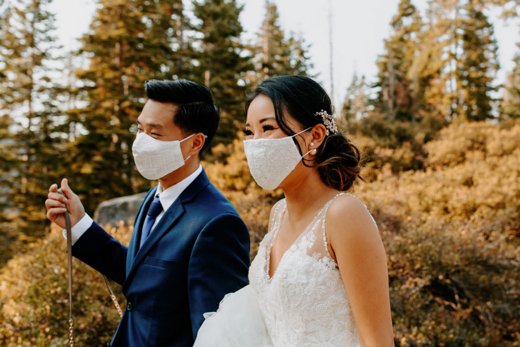 bride and groom walking in masks, Taft Point elopement, Yosemite Elopement, Glacier Point Elopement, best places to elope in california, northern california elopement, Rachel Christopherson Photography