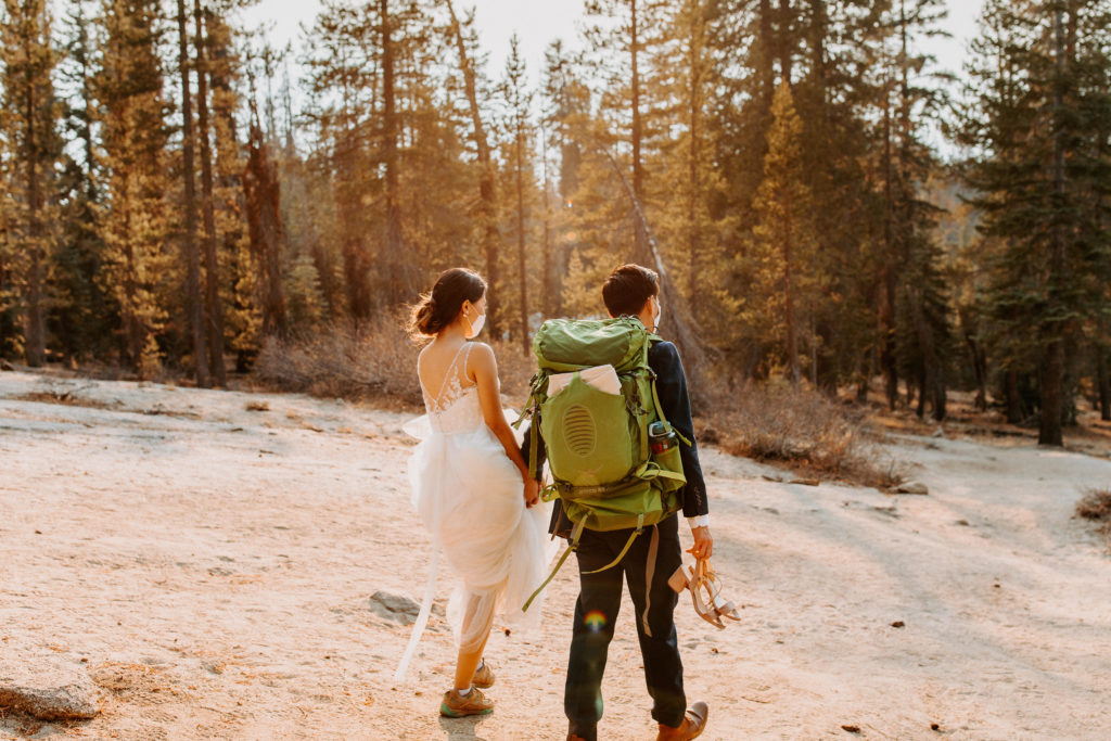 Bride and groom walking in sunlight, Taft Point elopement, Yosemite Elopement, Glacier Point Elopement, best places to elope in california, northern california elopement, Rachel Christopherson Photography