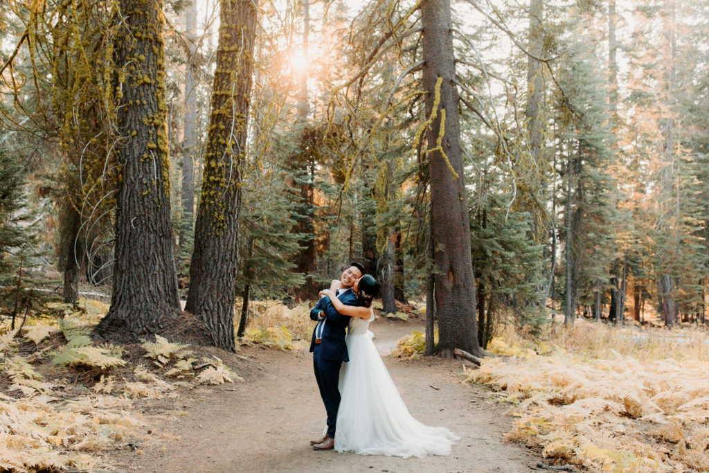 bride and groom in forest, adventurous bride, wedding dress and hiking boots, Taft Point elopement, Yosemite Elopement, Glacier Point Elopement, best places to elope in california, northern california elopement, Rachel Christopherson Photography