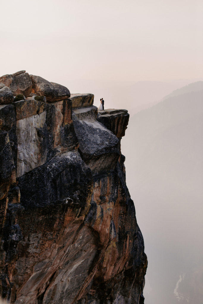 Wide shot of Bride and groom at Taft Point,, Taft Point elopement, Yosemite Elopement, Glacier Point Elopement, best places to elope in california, northern california elopement, Rachel Christopherson Photography