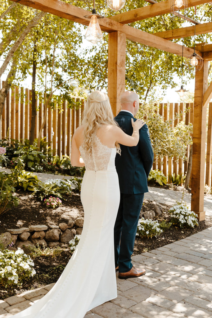 Rachel Christopherson Photography-Sacramento Garden Wedding-Rustic Wedding-Summer Wedding-Northern California-Nor Cal-Bride and Groom-Lace Back Wedding Dress-Wedding Dress With Train-Bride and Groom First Look-Navy Suit-Brown Leather Shoes-Bridal Hair