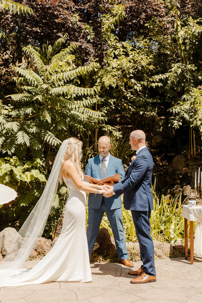 Rachel Christopherson Photography-Sacramento Garden Wedding-Rustic Wedding-Summer Wedding-Northern California-Nor Cal-Wedding Ceremony-Exchanging Vows-Wedding Dress With Train-Bridal Veil-Navy Groom's Suit