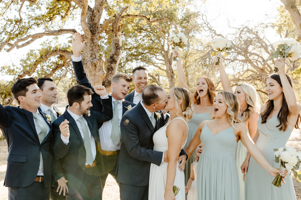 rachel christopherson photography-wedding photographer-wedding photography-wedding photos-wedding album-wedding photo album-wedding party-fun wedding party photos-bride and groom kissing