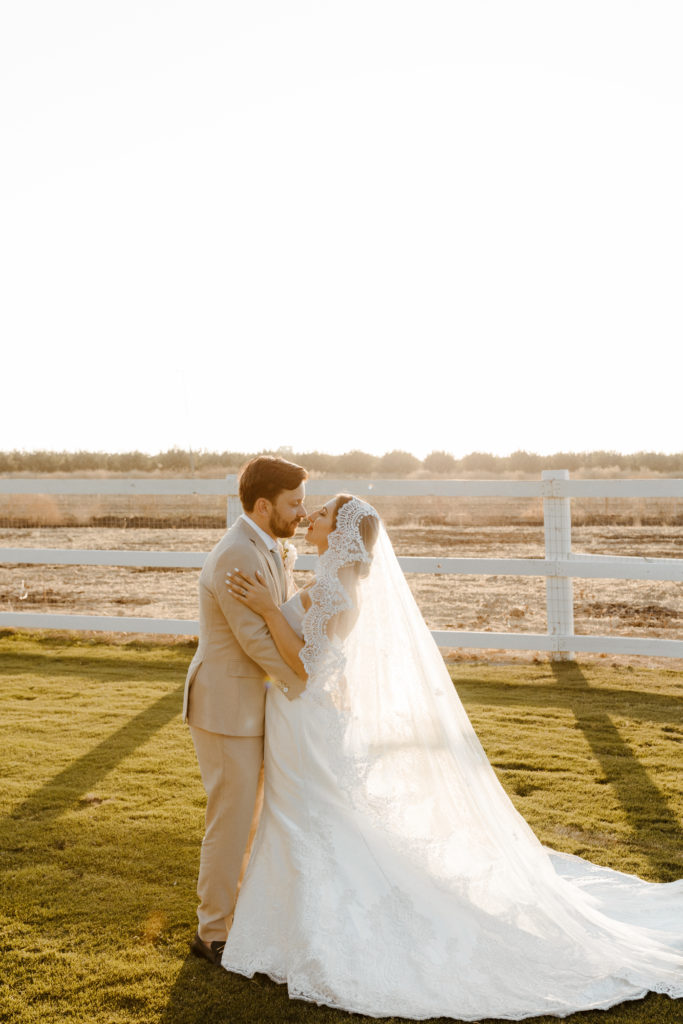 rachelchristophersonphotography-northern califorrnia wedding-traditional wedding-nor cal wedding-traditional ceremony-northern california wedding photographer-sacramento wedding-sacramento wedding photographer-ranch wedding-golden hour-lacey wedding dress-beige grooms suit-long train veil-bridal veil