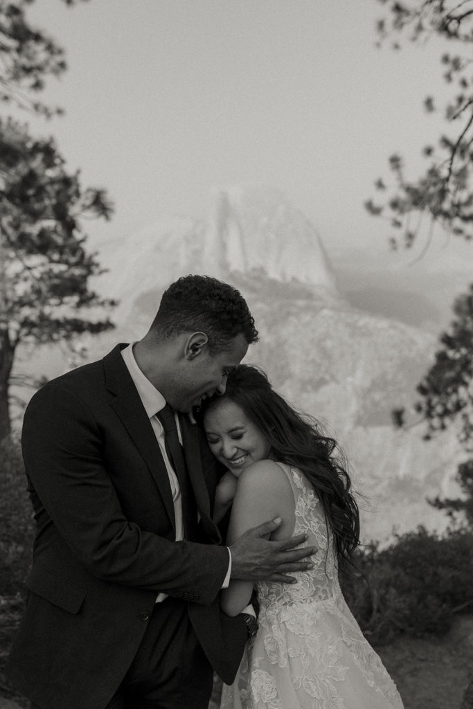 rachelchristophersonphotos-glacier point yosemite elopement-yosemite elopement-glacier point elopement-mountain top elopement-northern california elopement-bride and groom-slick black suit-lacey floral wedding gown-black and white wedding photos