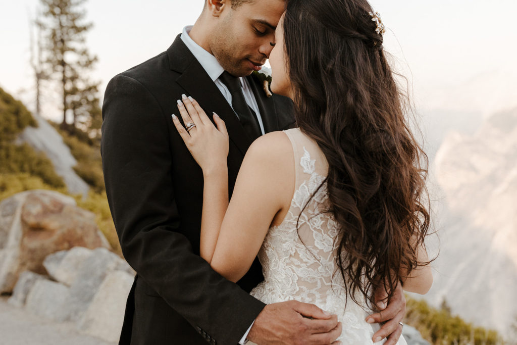 rachelchristophersonphotos-glacier point yosemite elopement-yosemite elopement-glacier point elopement-mountain top elopement-northern california elopement-bride and groom-slick black suit-lacey floral wedding gown