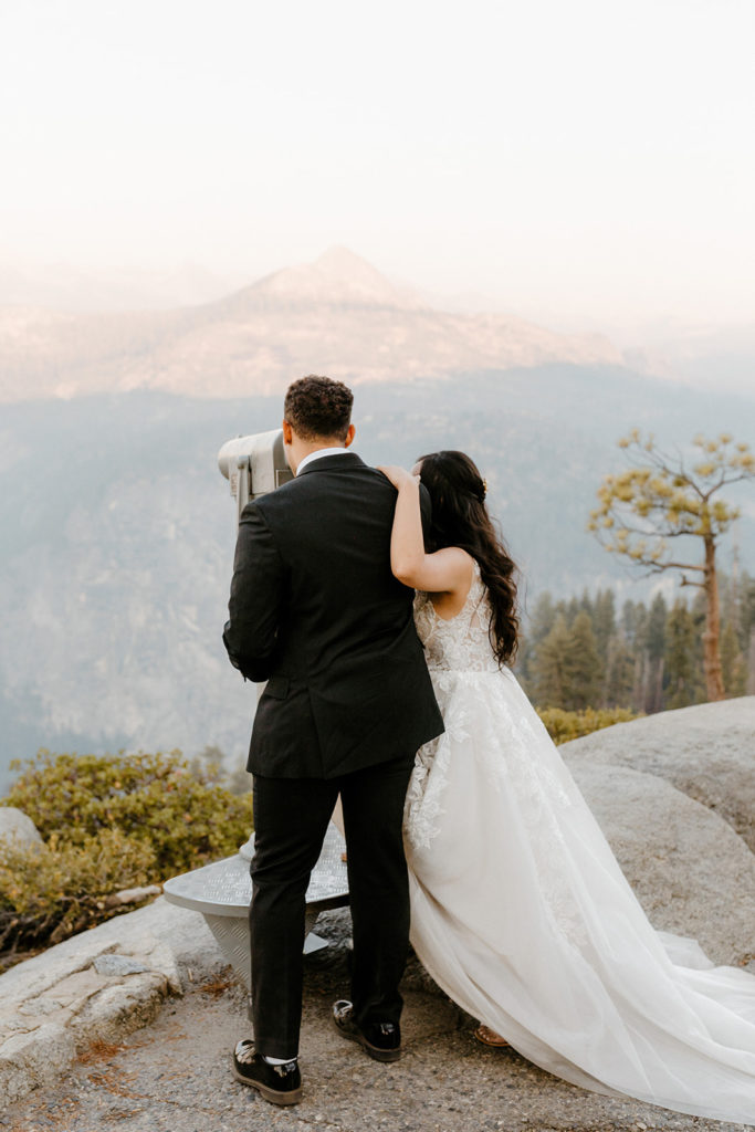 rachelchristophersonphotos-glacier point yosemite elopement-yosemite elopement-glacier point elopement-mountain top elopement-northern california elopement-bride and groom-slick black suit-lacey floral wedding gown