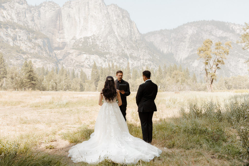 rachelchristophersonphotos-swinging bridge-yosemite elopement-yosemite elopement-swinging bridge elopement-mountain top elopement-northern california elopement-bride and groom-slick black suit-lacey floral wedding gown