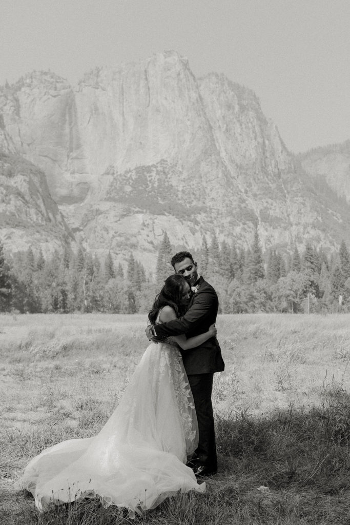 rachelchristophersonphotos-swinging bridge-yosemite elopement-yosemite elopement-swinging bridge elopement-mountain top elopement-northern california elopement-bride and groom-slick black suit-lacey floral wedding gown-black and white wedding photos