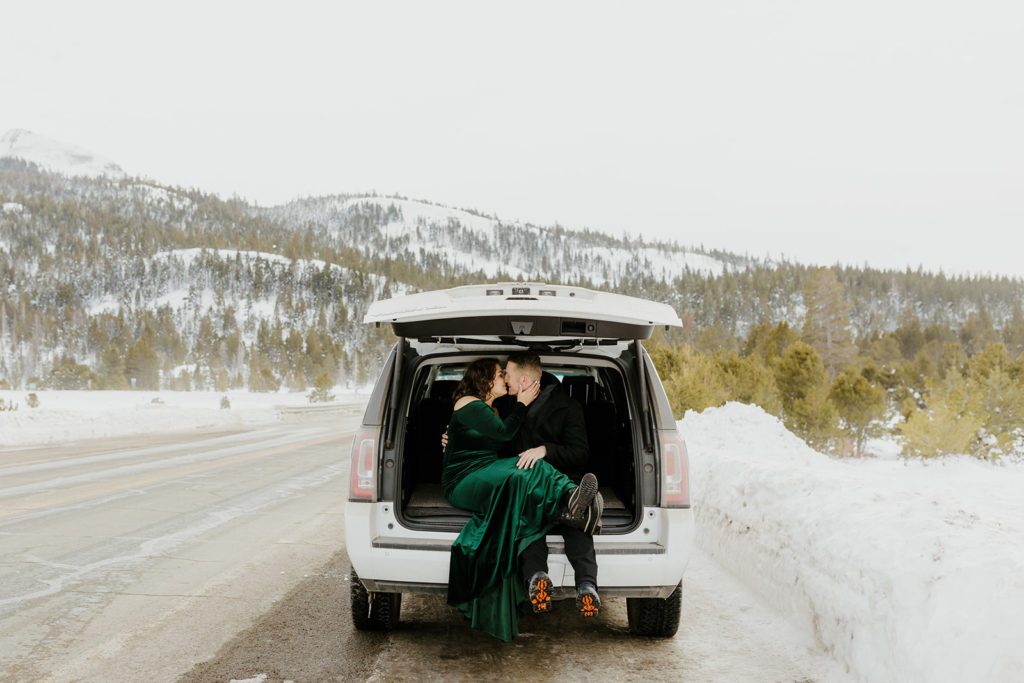 Rachel Christopherson Photography -  Lake Tahoe winter engagement photos, engaged couple snuggled in car parked in front of snowy mountain