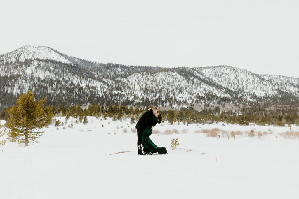 Rachel Christopherson Photographer - Lake tahoe snow engagement photos, engaged couples kissing in front of snowy mountain