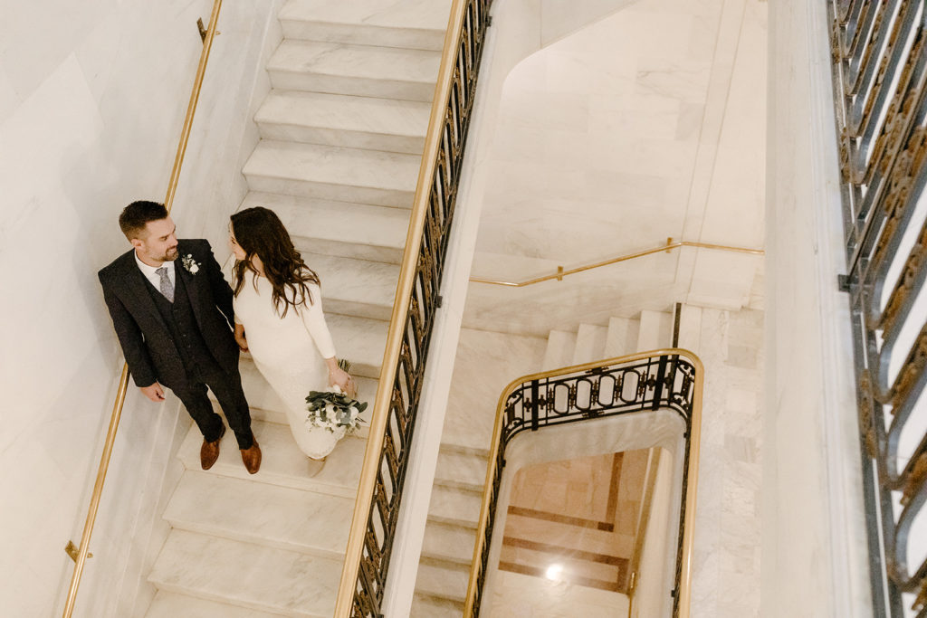 Rachel Christopherson Photographer-SF, San Francisco city hall elopement, san francisco wedding, bride and groom walking down stairs, candid portrait