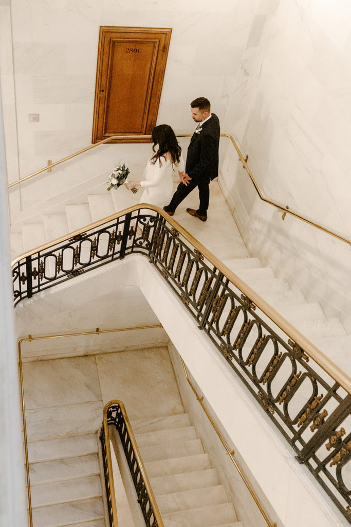Rachel Christopherson Photographer-SF, San Francisco city hall elopement, san francisco wedding, bride and groom walking down stairs, candid wedding portraits
