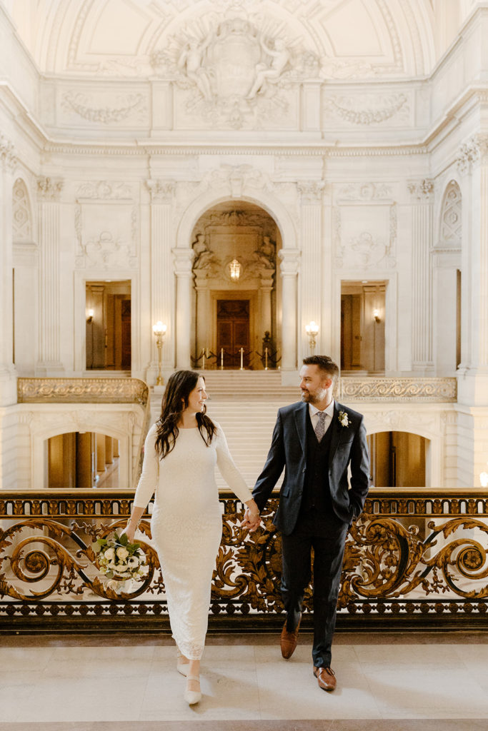 Rachel Christopherson Photographer-SF, San Francisco city hall elopement, san francisco wedding, bride and groom candid portrait, ivory wedding dress, dark gray grooms suit