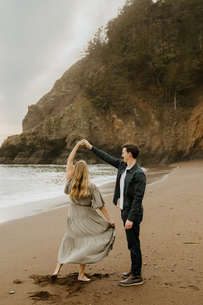 Rachel Christopherson Photography - Engaged couple dancing on northern california beach , kirby cove engagement photos, beach engagement photos