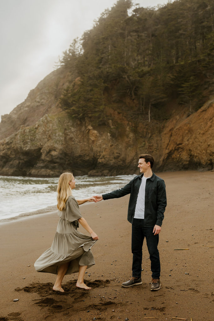 Rachel Christopherson Photography - Engaged couple dancing on northern california beach , kirby cove engagement photos, beach engagement photos