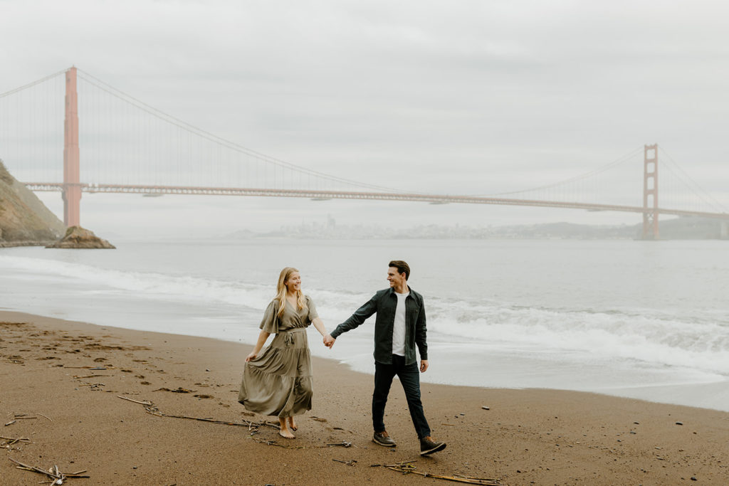 Rachel Christopherson Photography - Engaged couple holding hands in front of golden gate bridge, bay area engagement photos