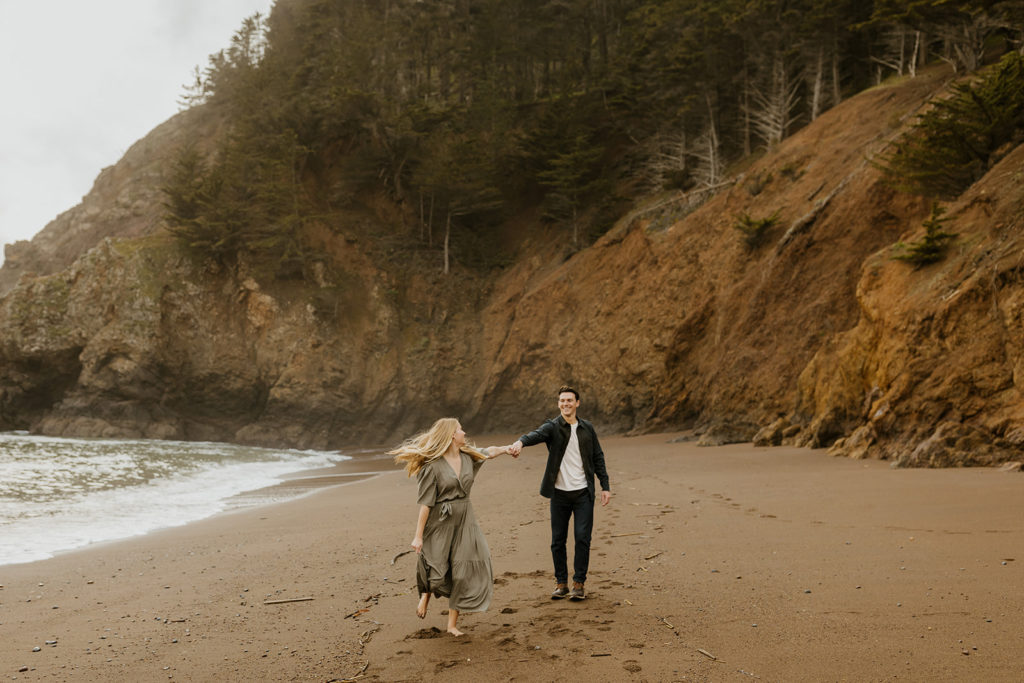 Rachel Christopherson Photography - Engaged couple holding hands on northern california beach , Marin Headlands engagement photos, beach engagement photos