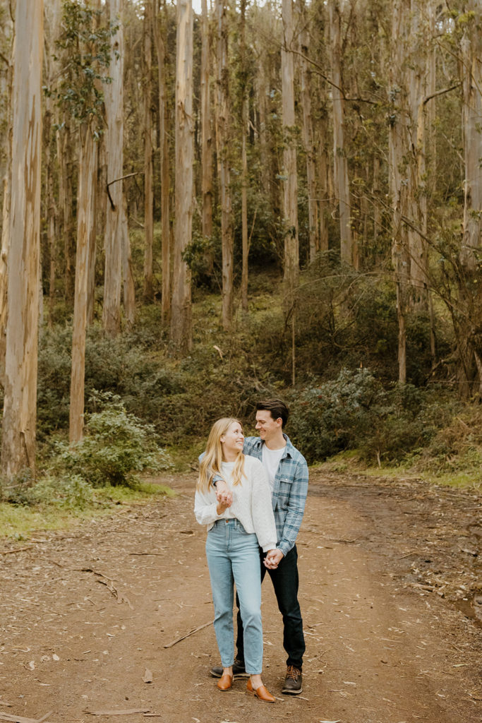 Rachel Christopherson Photography - Engaged couple holding each other, candid engagement photoskirby cove engagement photos