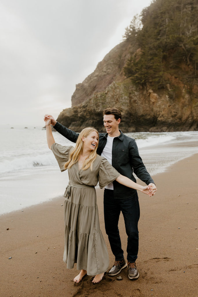 Rachel Christopherson Photography - Engaged couple holding hands on northern california beach , kirby cove engagement photos