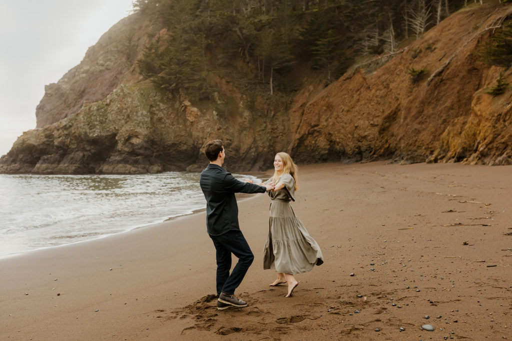 Rachel Christopherson Photography - Engaged couple holding hands on northern california beach , Bay Area engagement photos, beach engagement photos