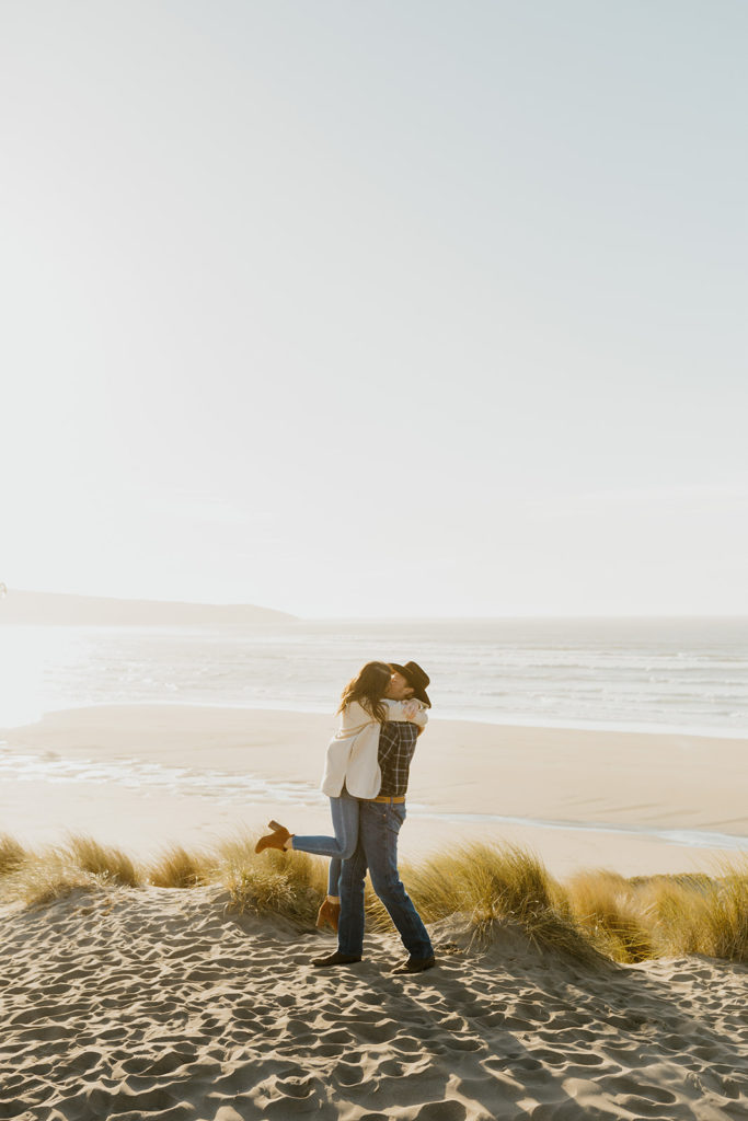 Rachel Christopherson Engagement Photographer-Engaged couple kissing on beach -San Francisco Engagement Photos, Northern California Engagement Photos, Point Reyes Engagement Photos, Bodega Bay Engagement Photos, Dillon Beach Engagement Photos, Bay Area Engagement Photos