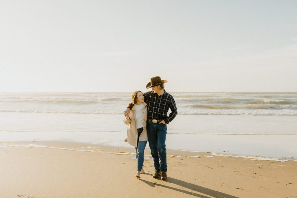 Rachel Christopherson Engagement Photographer-Engaged couple holding each other and smiling on beach-San Francisco Engagement Photos, Northern California Engagement Photos, Point Reyes Engagement Photos, Bodega Bay Engagement Photos, Dillon Beach Engagement Photos, Bay Area Engagement Photos