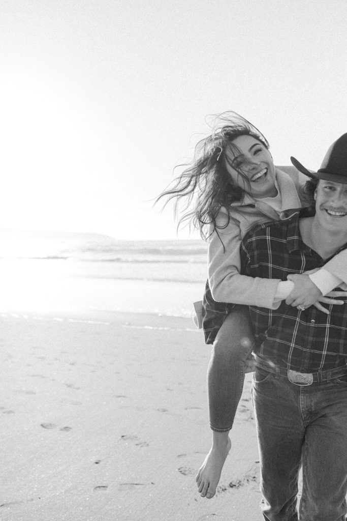 Rachel Christopherson Engagement Photographer-Engaged couple holding each other and smiling, black and white engagement photo-San Francisco Engagement Photos, Northern California Engagement Photos, Point Reyes Engagement Photos, Bodega Bay Engagement Photos, Dillon Beach Engagement Photos, Bay Area Engagement Photos