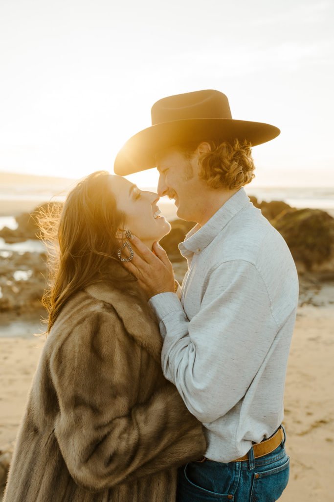 Rachel Christopherson Engagement Photographer-Engaged couple smiling at each other on beach-San Francisco Engagement Photos, Northern California Engagement Photos, Point Reyes Engagement Photos, Bodega Bay Engagement Photos, Dillon Beach Engagement Photos, Bay Area Engagement Photos