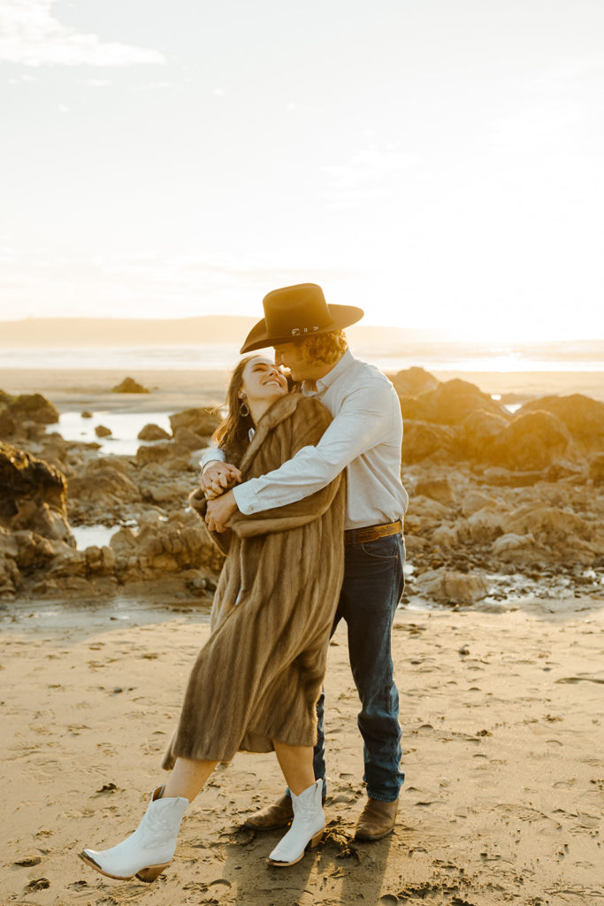 Rachel Christopherson Engagement Photographer-Engaged couple holding each other and kissing on beach-San Francisco Engagement Photos, Northern California Engagement Photos, Point Reyes Engagement Photos, Bodega Bay Engagement Photos, Dillon Beach Engagement Photos, Bay Area Engagement Photos