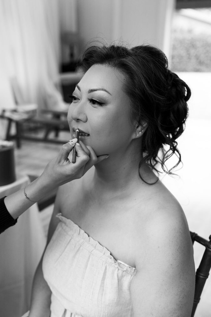 Rachel Christopherson Photography - North Shore Oahu wedding at Sunset Ranch, bride getting ready photos, bride getting makeup done, black and white wedding photos
