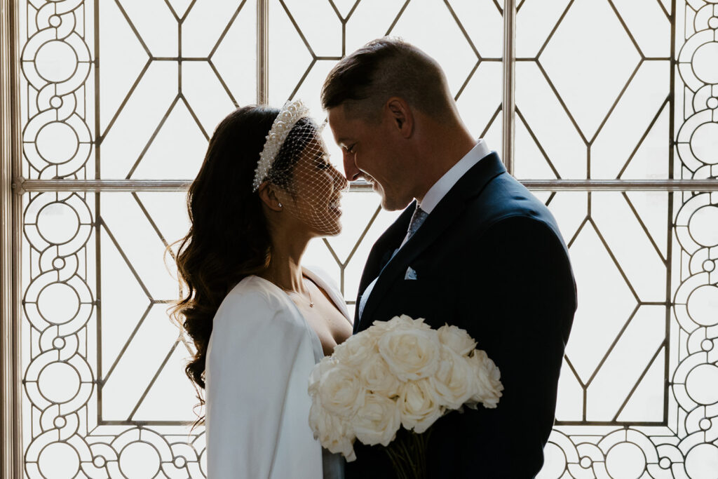 Rachel C Photography - bride and groom in front of san francisco city hall window