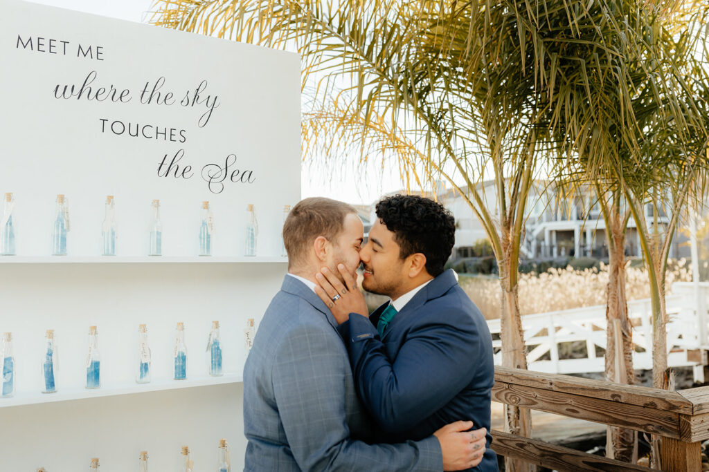 Rachel C Photography - Classy beach inspired wedding, grooms kissing