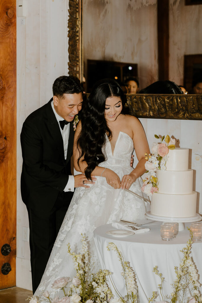 Rachel C Photography - bride and groom cake cutting, floral wedding cake
