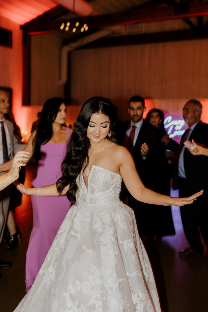 Rachel C Photography - fun wedding reception, bride dancing 