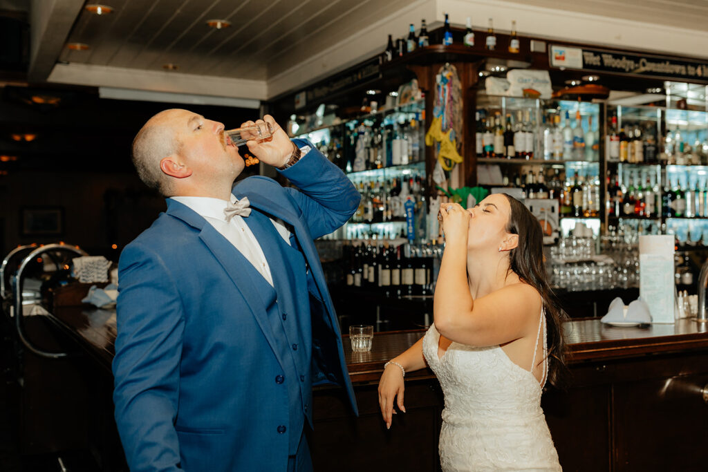 Bride and groom taking a shot