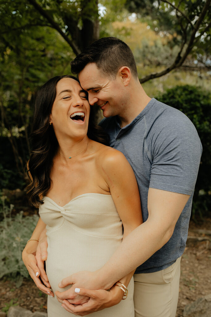 Couple laughing together during photoshoot