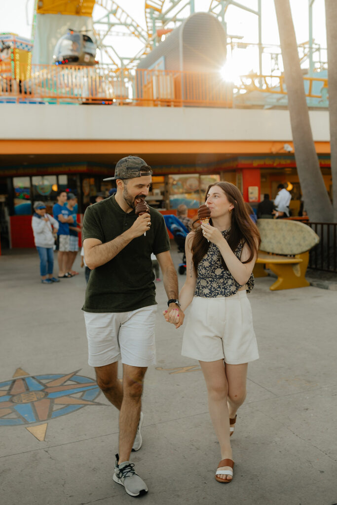 Couple eating ice cream on the Santa Cruz boardwalk for engagement session