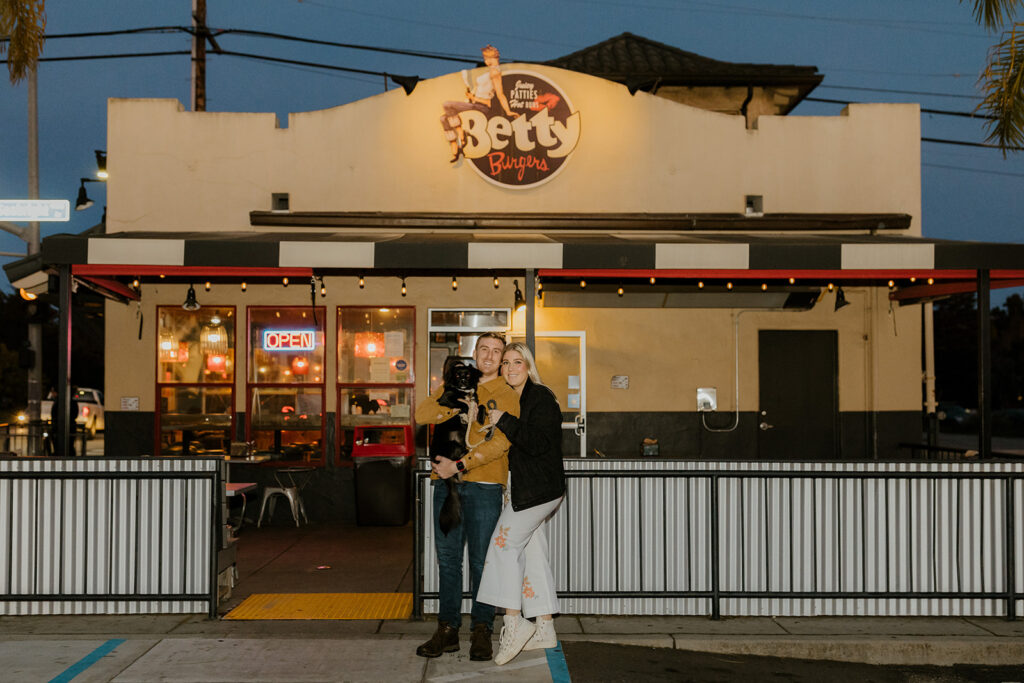 Playful couples photos at the original Betty's Burgers in Santa Cruz, CA