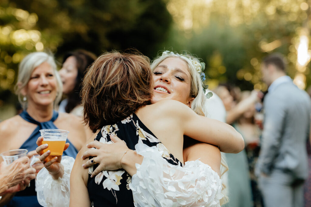 Bride hugging guest