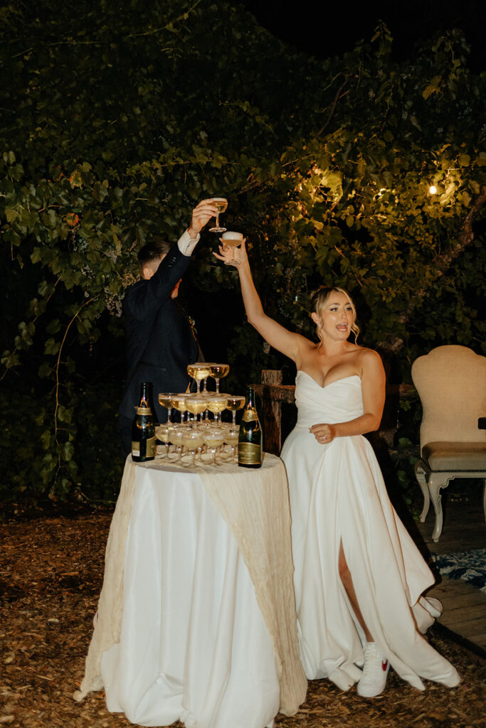 Bride and groom doing champagne tower