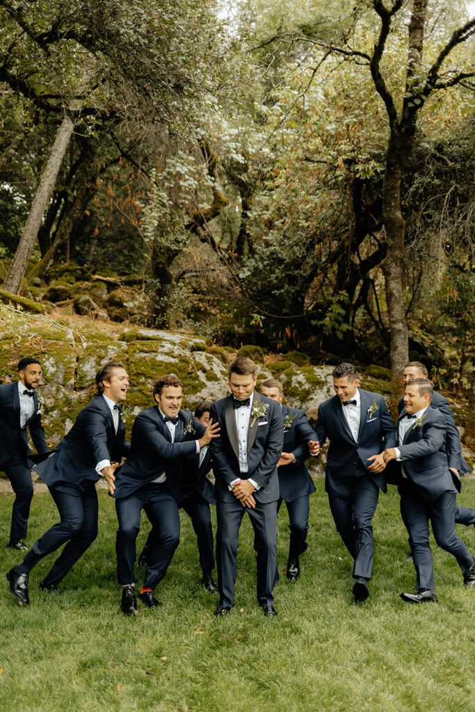 Groom and groomsmen photos from a glamping wedding weekend at The Ranch at Stoney Creek