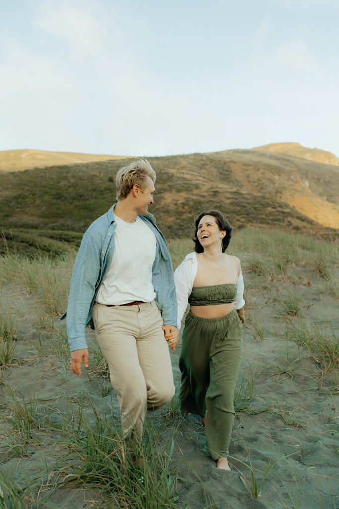 Couple walking in an open field