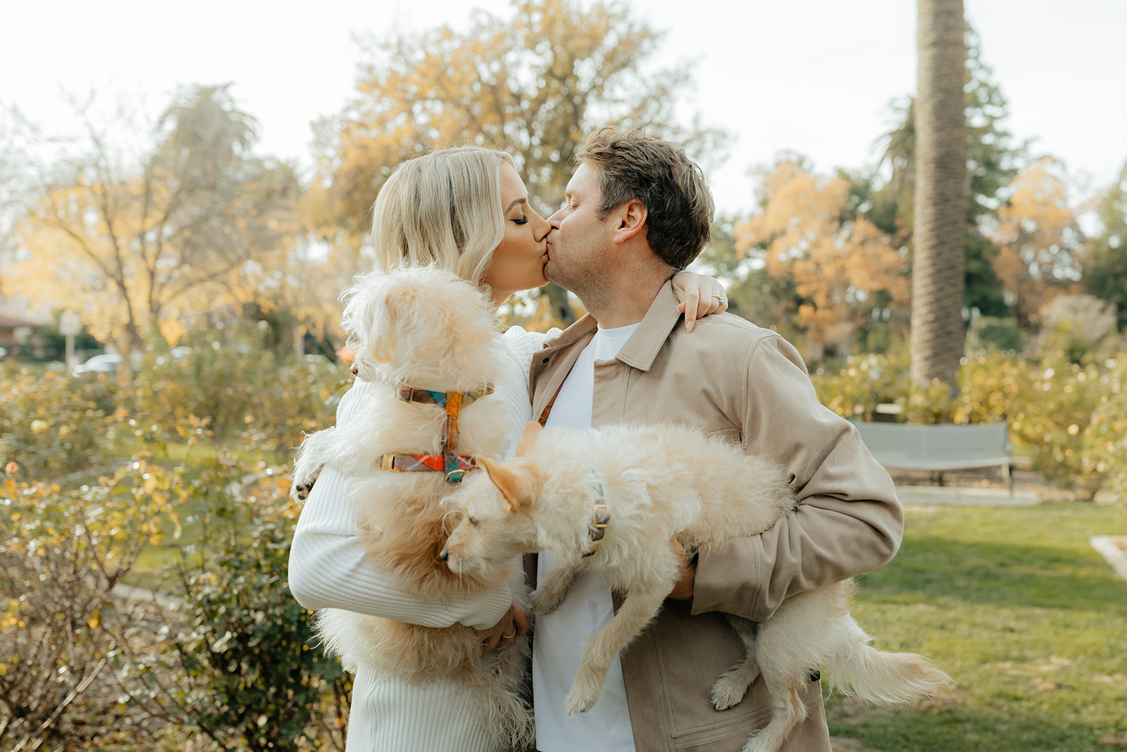 Couples Sacramento engagement photos at McKinley Park with their two dogs