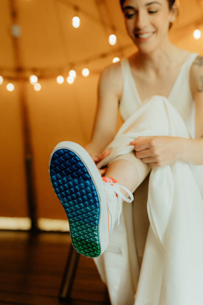 bride putting on her wedding shoes 