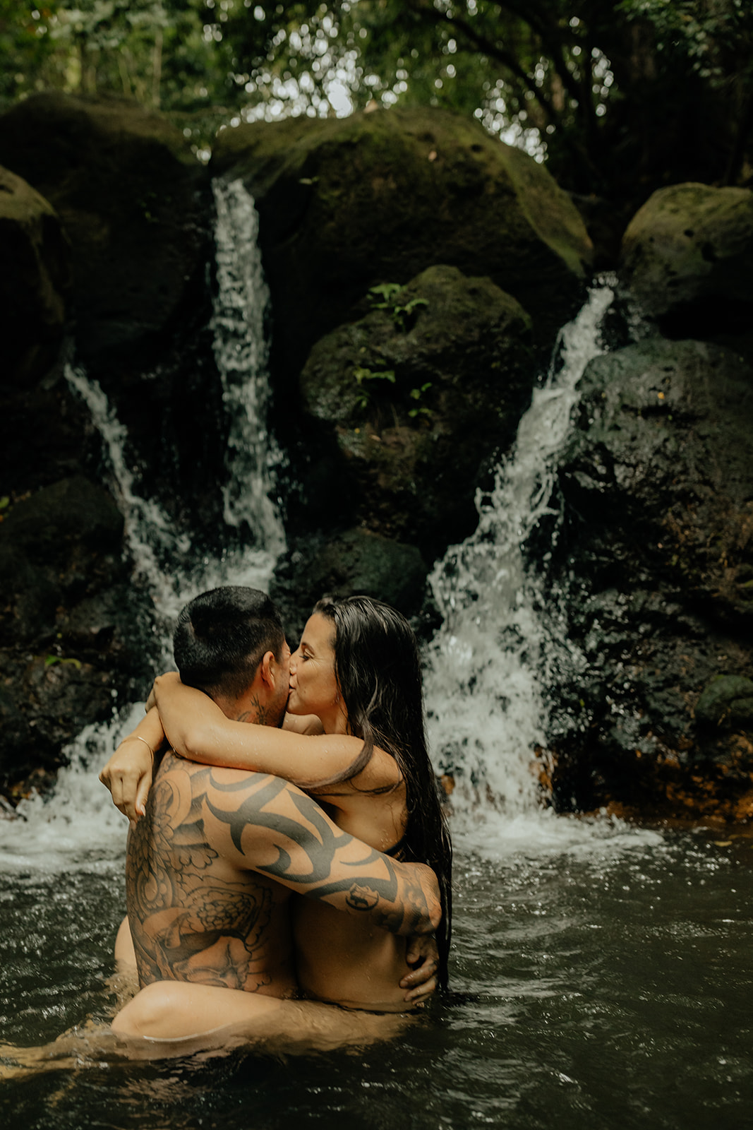 couple swimming during their couples session