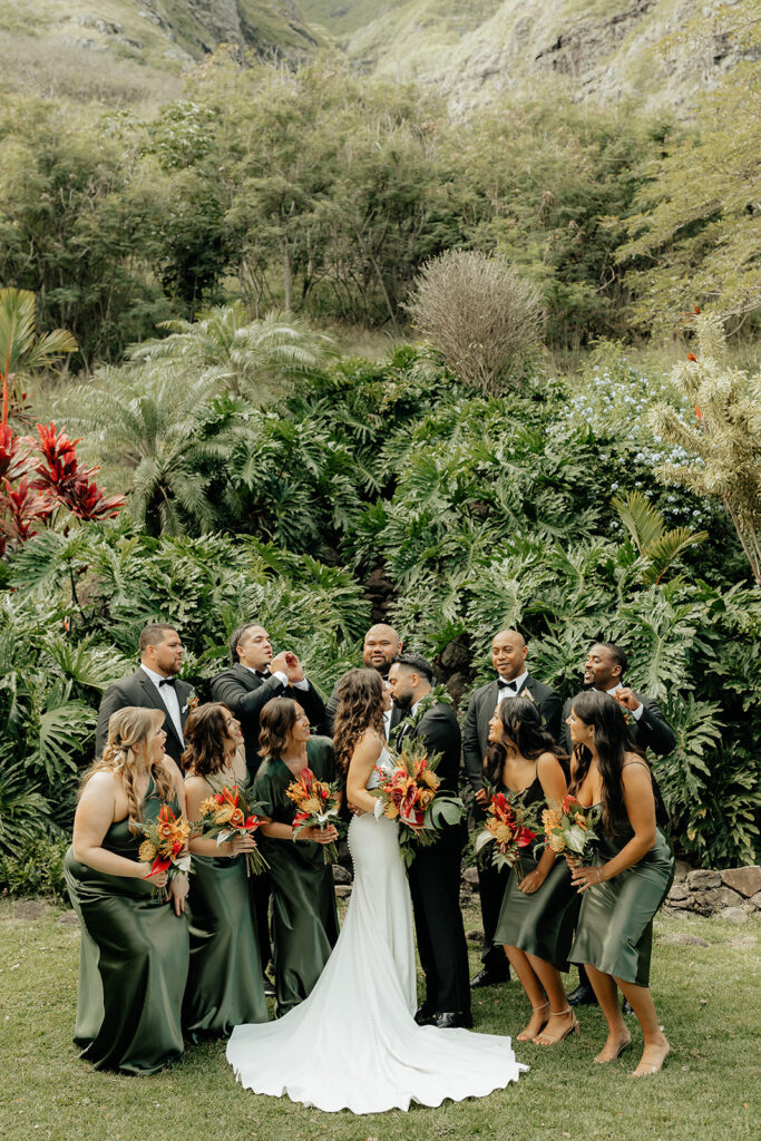 bride and groom kissing -Colorful Eco-Friendly Wedding at Kualoa Ranch, HI
