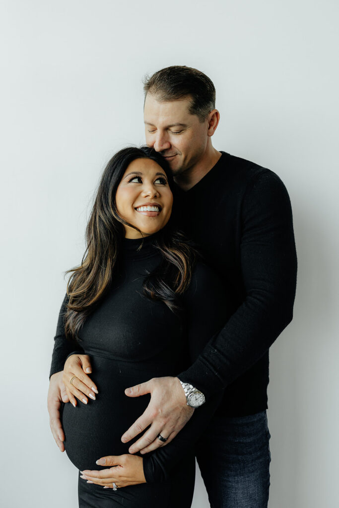happy mom and dad to be during their maternity session