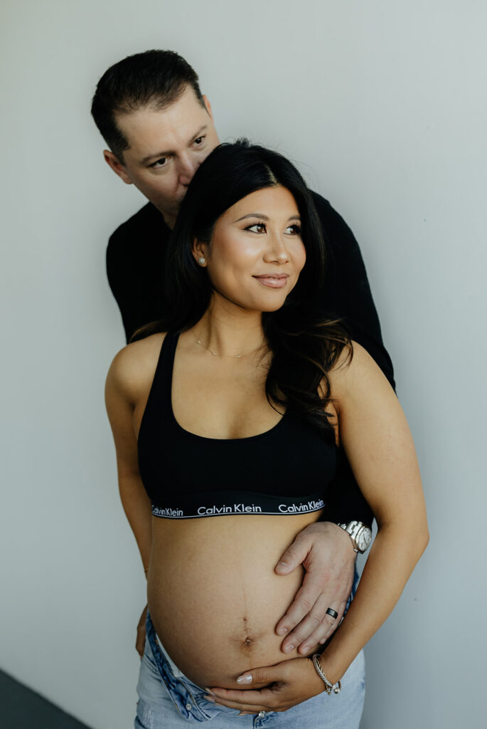 couple hugging during their maternity session