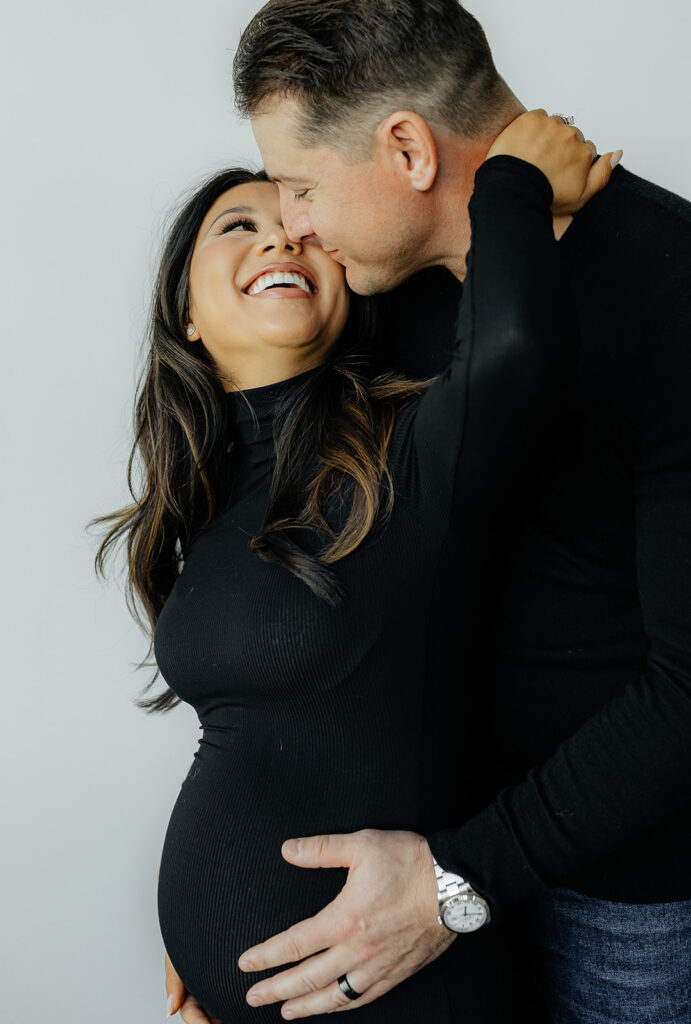 couple looking at each other during their maternity photoshoot